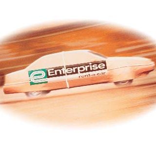 An Enterprise cream-colored car in a red-tinted graphic