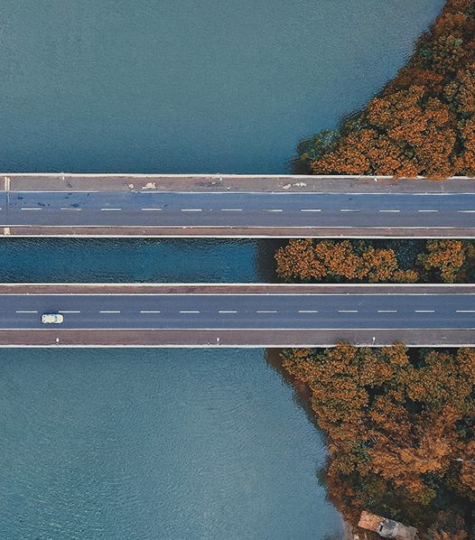 Aerial shot of a bridge over water.