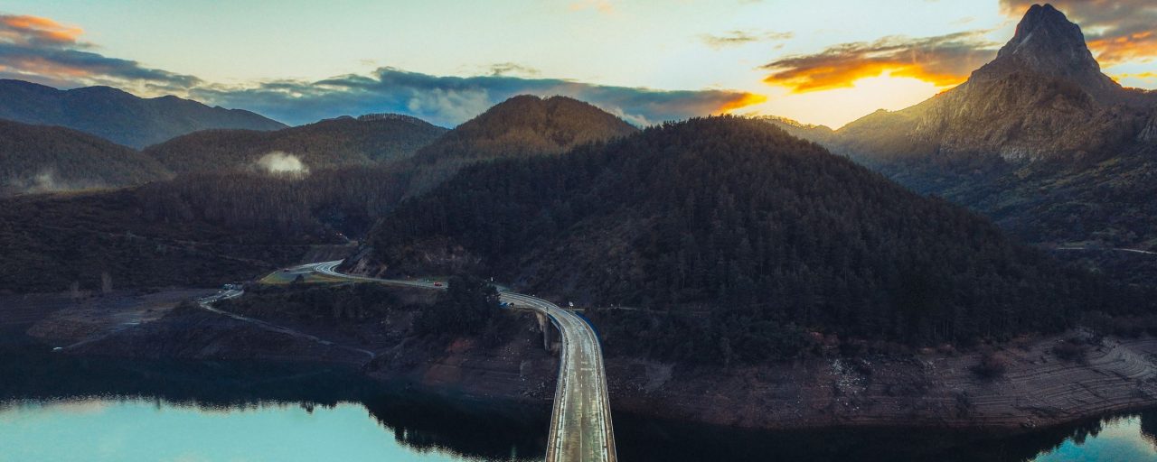 Hero image graphic for ESG reporting page with mountain and water